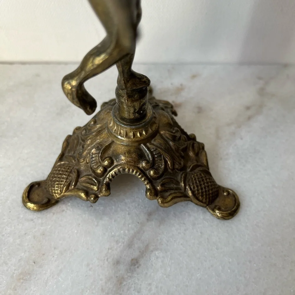 Antique cherub figurine candle holder